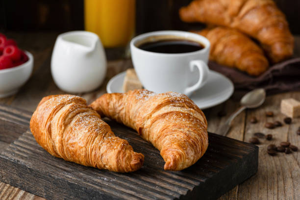 Croissants with a coffee in the background